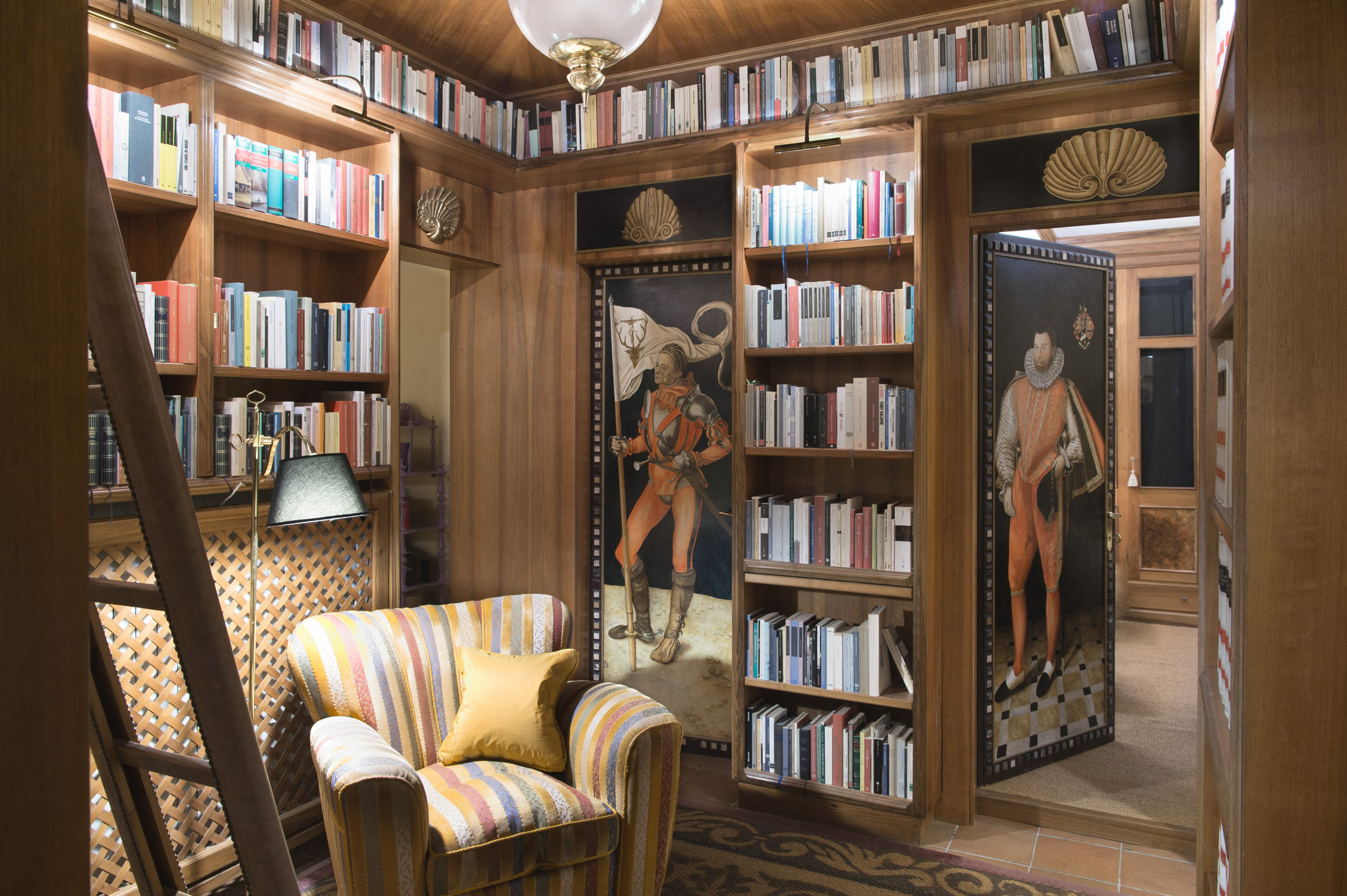 Wood-panelled library with painted doors