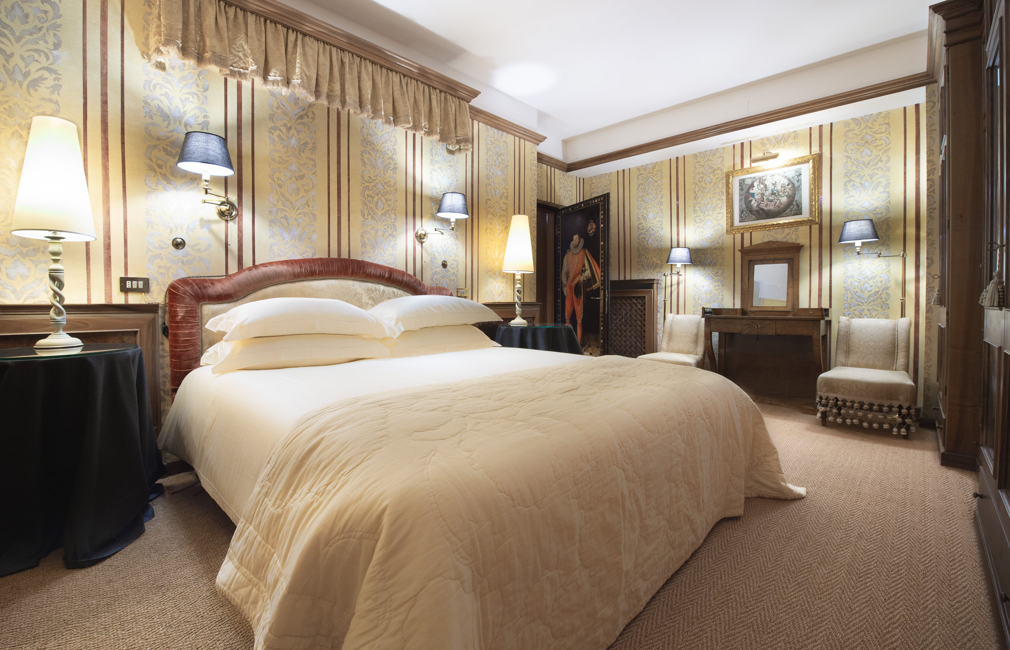Classic bedroom with striped walls and portrait
