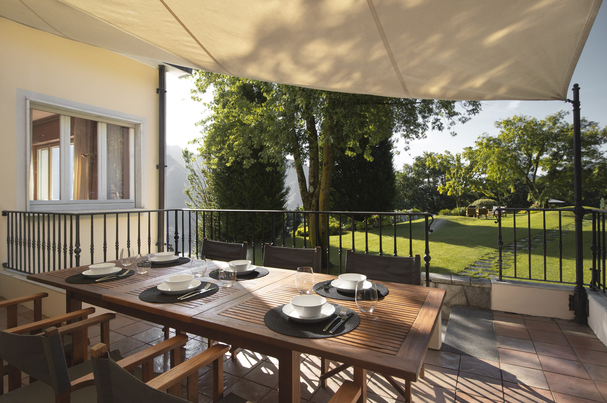 Covered terrace dining beside the garden